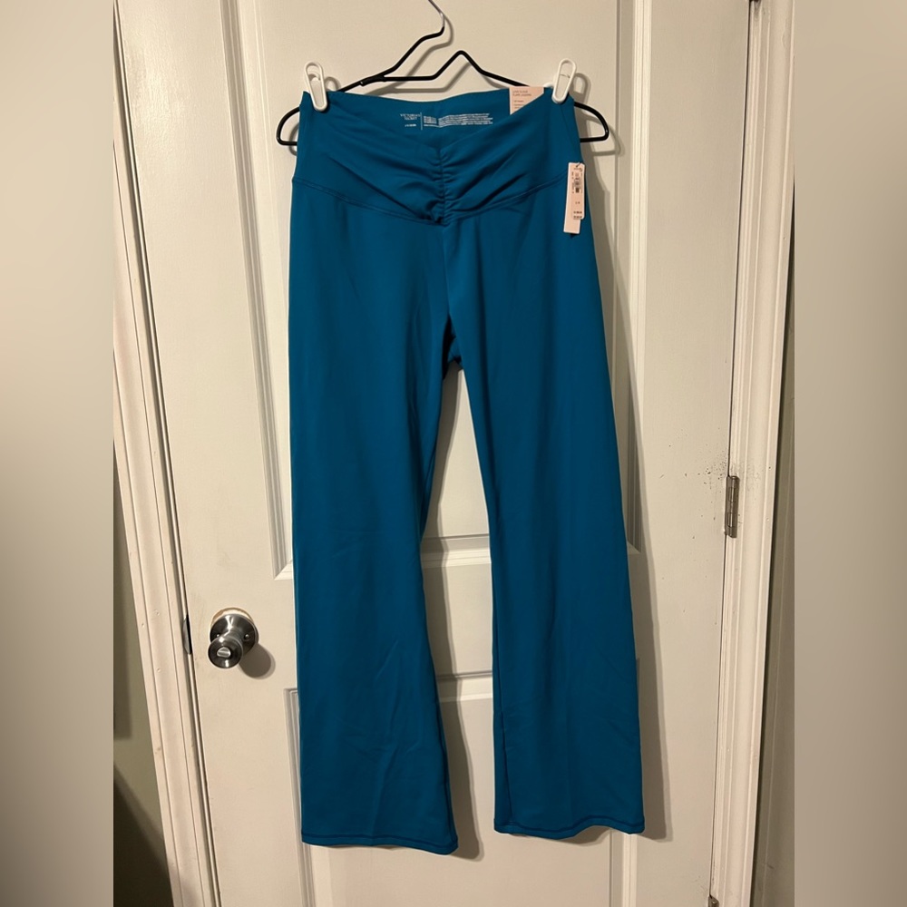 Blue Victoria’s Secret sport flared leggings.